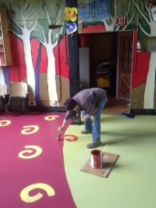 Betsy Bowen is just about finished painting the floor in the redesigned What's Upstairs? Stage above her studio at 301 1st Ave. W.