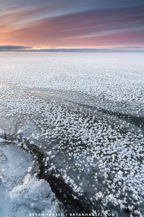 Forest flowers covering the ice on Lake Superior at sunrise from Artist's Point.