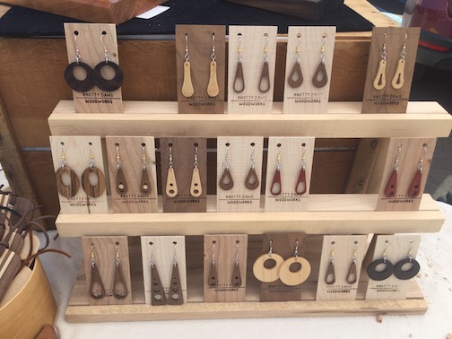 Jake Carr makes a variety of wooden items, including these earrings. He is one of the artisans at the Cook County Market, which runs from 9 a.m. to 1 p.m. on Saturdays through mid-October.