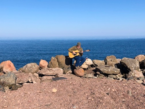 Todd Sylvester plays a few tunes on the East Bay on one of our warmer days.