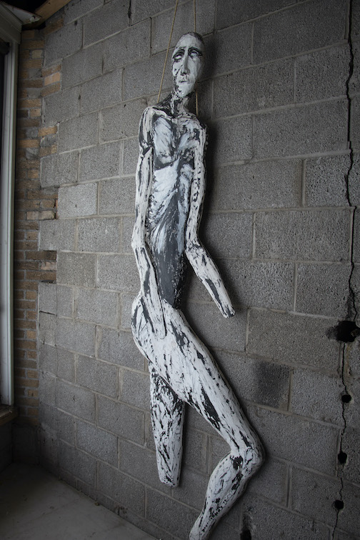 Hungry Ghost by John Books. The sculpture is in a window at Studio 17.