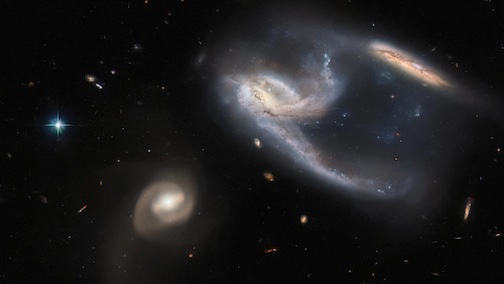 3 galaxies, photograph by Hubble telescope via NASA.