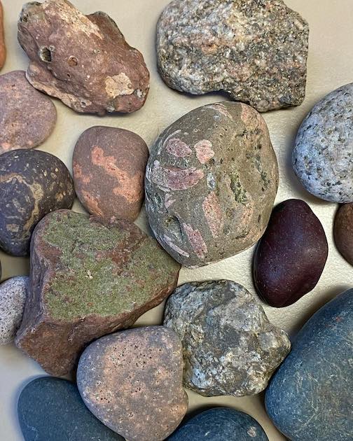 Spring rocks give up their warmth to waiting hands. Photo by Mary Beams.