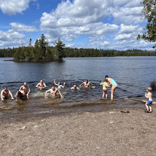 Spring is not official until the Sawbill crew opens the beach club for the season. A little late ice-out meant fewer staff participated, but we still got 12 people in the water. Welcome Summer. Photo courtesy of Sawbill Outfitters.