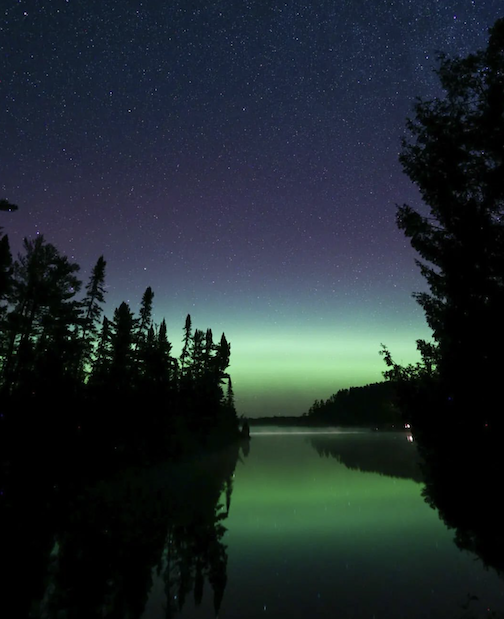 The Aurora in the Superior National Forest by Thomas Spence.