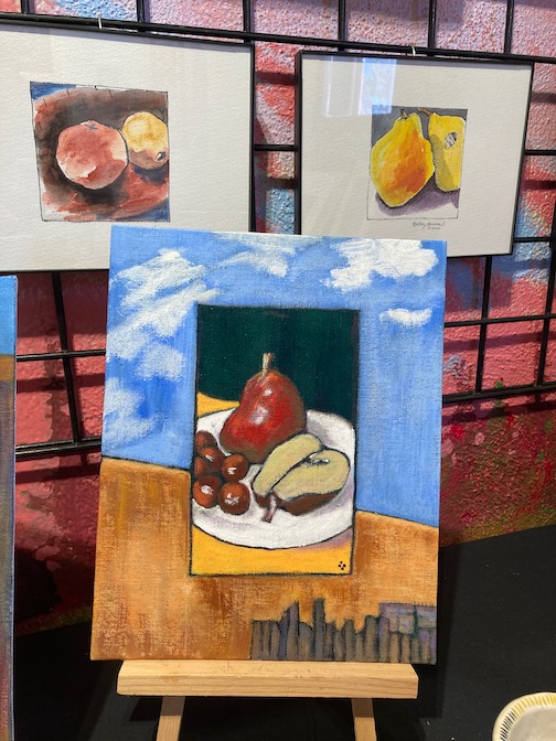 Eating pears in Santa Fe, acrylic painting by BetsyBowen, is one of the new works at the Holiday Underground show.