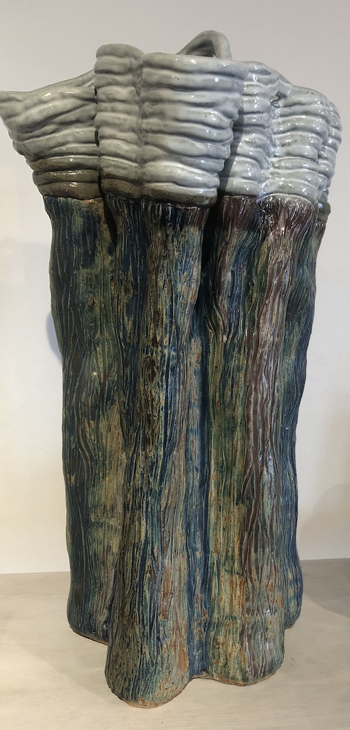 Fertile Darkness by Kathleen Gilbertson, clay and acrylic, is one of the piece in the show.