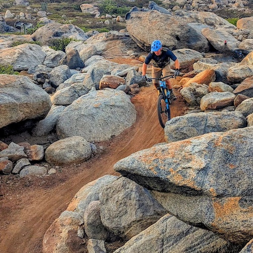 Riding the good line through a sea of boulders in Aruba. Not a bad way to spend a Sunday morning by Mica Harju.