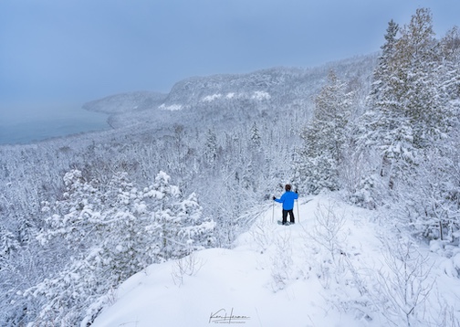 Snowshoeing to an Overlook in a Foot of New-Fallen Snow by Ken Harmon.