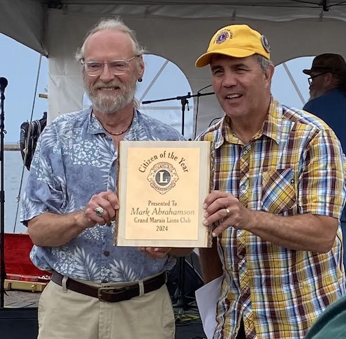 Mark Abrahamson, left, was the Cook County Citizen of the Year in 2024. Lions Club president Pete Kavanaugh presented the ward to Mark at Fisherman's Picnic last year.