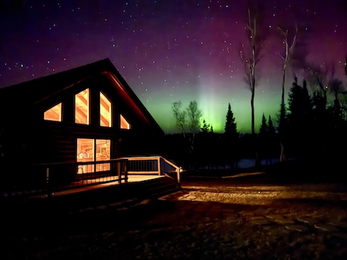Northern lights right above the house. Armstrong Lake, Ely by Paul Pluskwik.