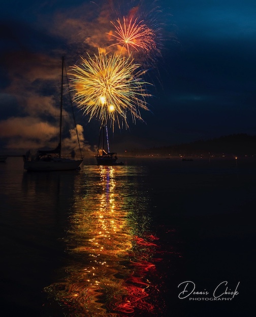 Fireworks over the Grand Marais Harbor 2 by Dennis Chick.