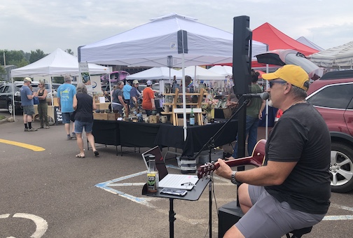 Pat Eilason playing at the Cook County Market on Saturday. Local musicians are featured every week.