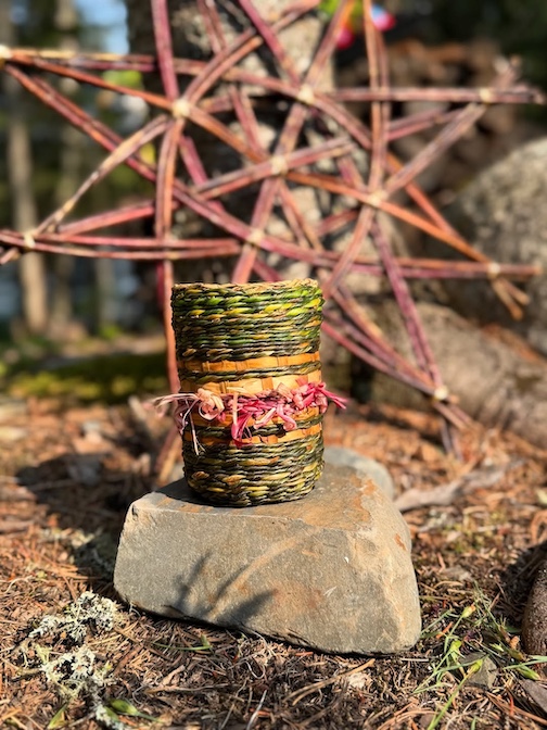 Summer camp art by Danna MacKenzie. Materials: willow bark, blue flag iris leaves, rhubarb, mason jar came with the cabin.