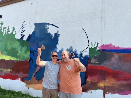 Painters Adam Swanson and Sam Zimmerman have started working on the wall mural at the co-op in Grand Marais.