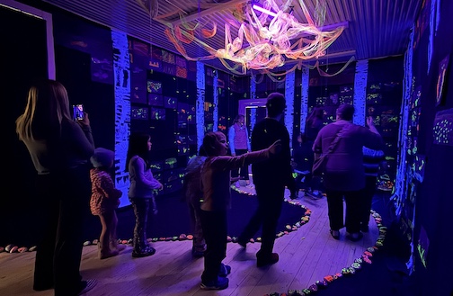 The bioluminescence exhibit continues through this week. The works are in the Cube Gallery at Studio 21 and were created during an art project for kindergarten through 2nd grade students. Photo by Ruth Pzwaro.