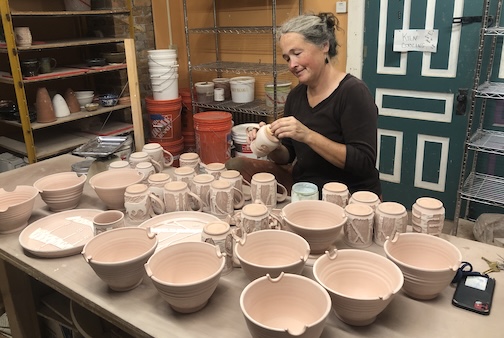 Potter. Ann Ward is getting her ots ready for a glaze firing. Shewill be at the Cook County Market on Saturday