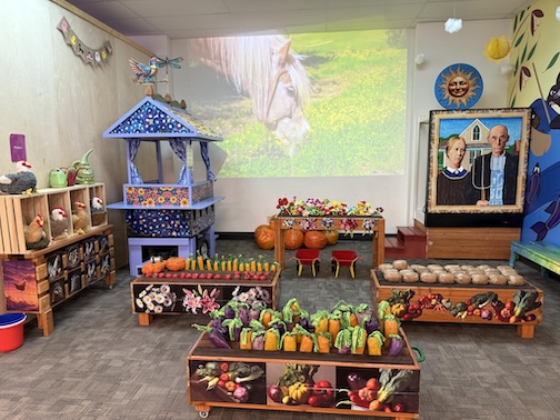 The Duluth Children's Museum Farmer's Market is ready for action, toys created by Ron Benson.