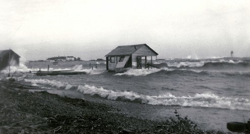 Before the breakwall was built in 1959, or closing the barn door after the horses had bolted. Photo posted by Dan Helmerson.