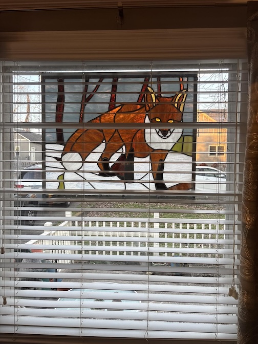 A stained glass fox, wondow a gift to me by jerry Vandiver.