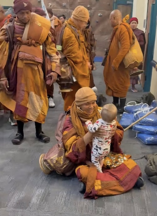 A monk with a baby from A Walk for Peace. Photo by Nadeeshani-De-Zoysa.