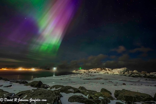 The night the Aurora sweeps across the Grand Marais MN harbor by David Johnson.