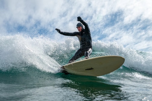 Alex catching a fun wave on the reef. st Stony Point by Christian Dalbec.