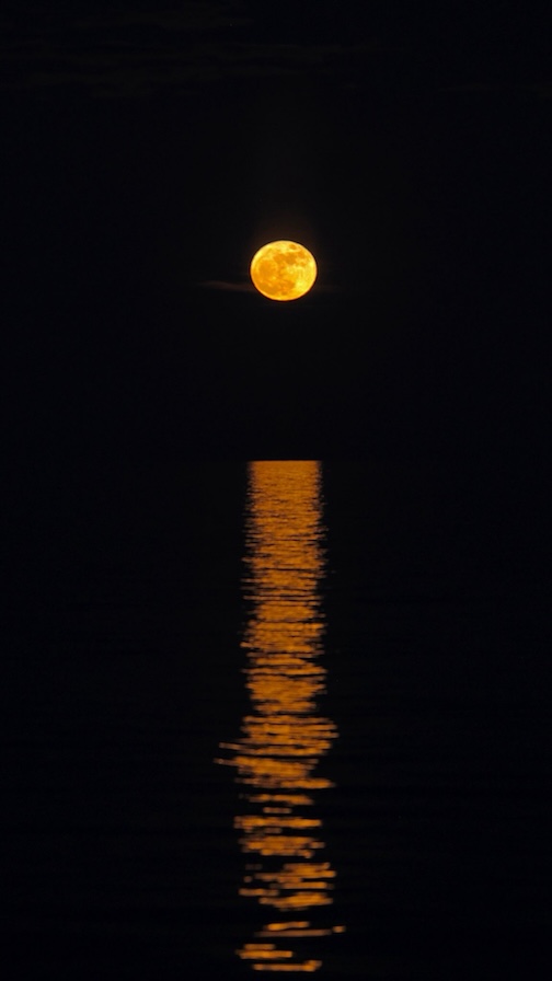Flower Moon over Lake Superior by Chuck Olson.