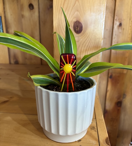 Fused glass garden stake by Laurie Roberts. Her work can be found at the Blue Moose and the Cook County Market.