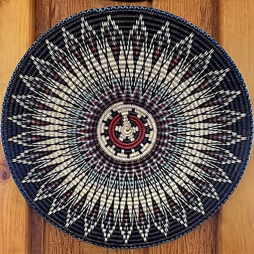 A deliberate flaw in the center of the basket so as not to insult the gods, by Peggy Tock Black, 3rd generation Diné ~ Navajo basket weaver.