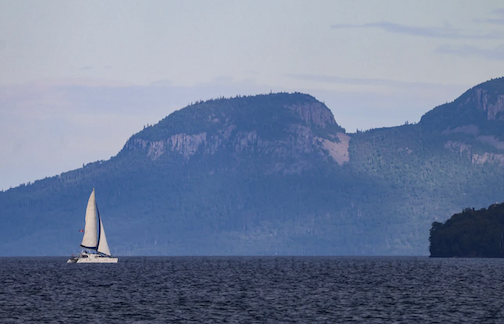 A sailboat and a giant by Chris Artist.